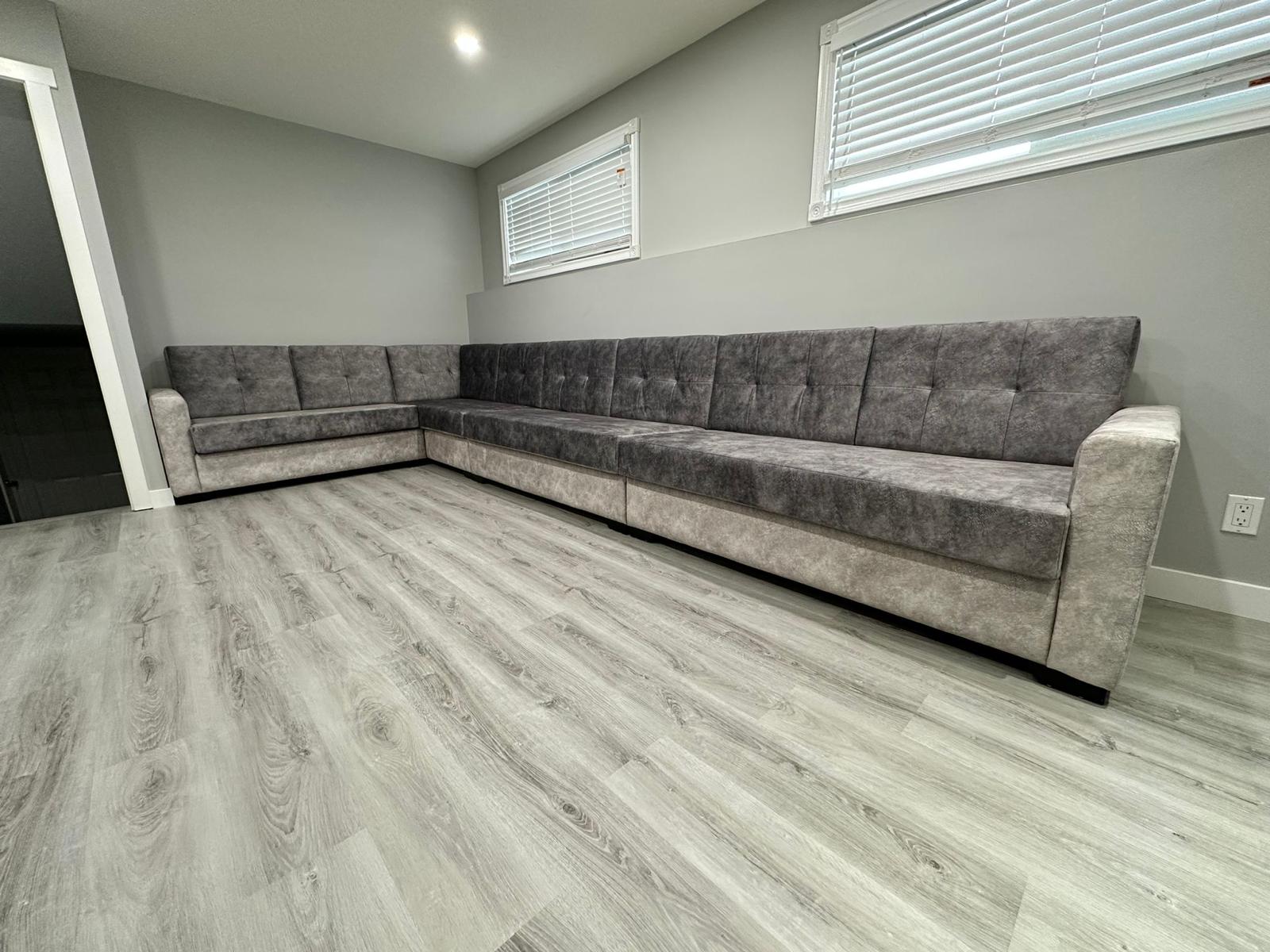 Large custom sectional sofa with button tufting