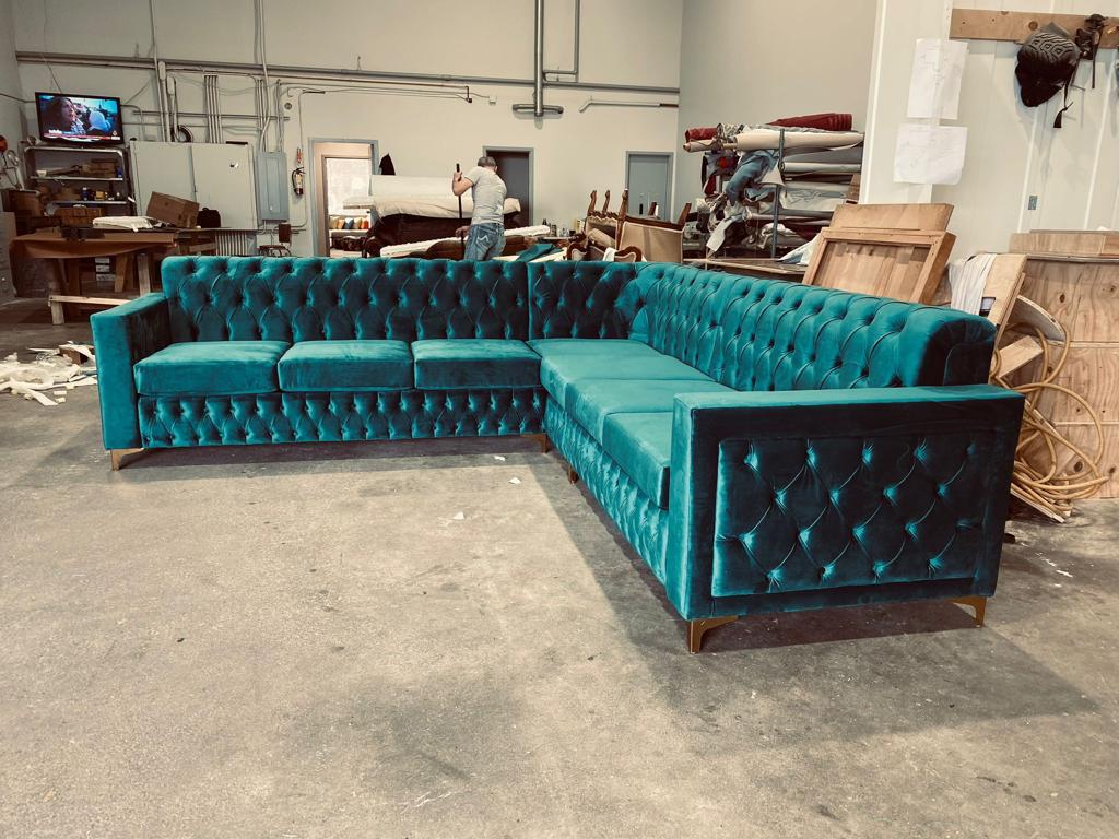 Luxury tufted sectional in teal velvet