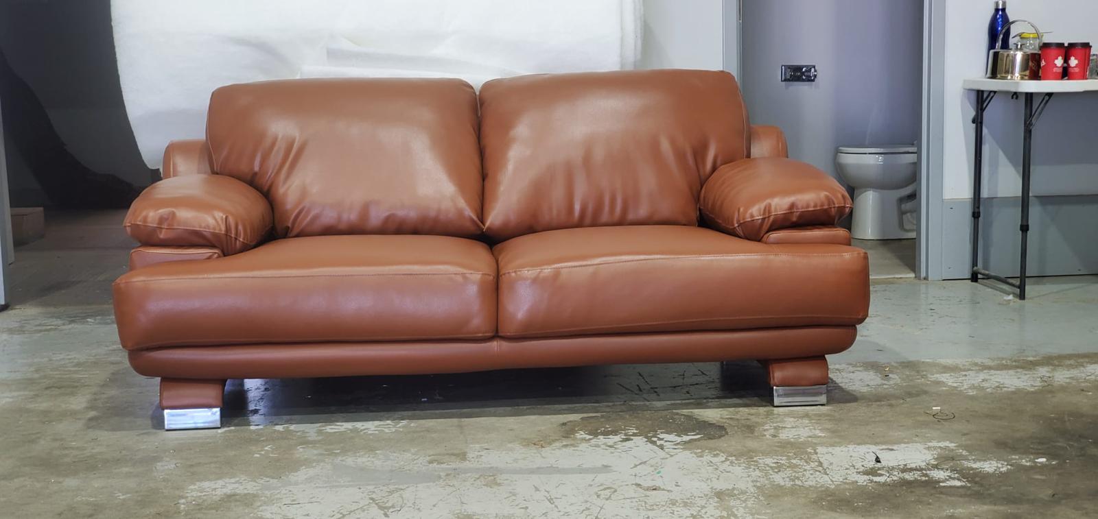 Modern leather sofa with chrome legs