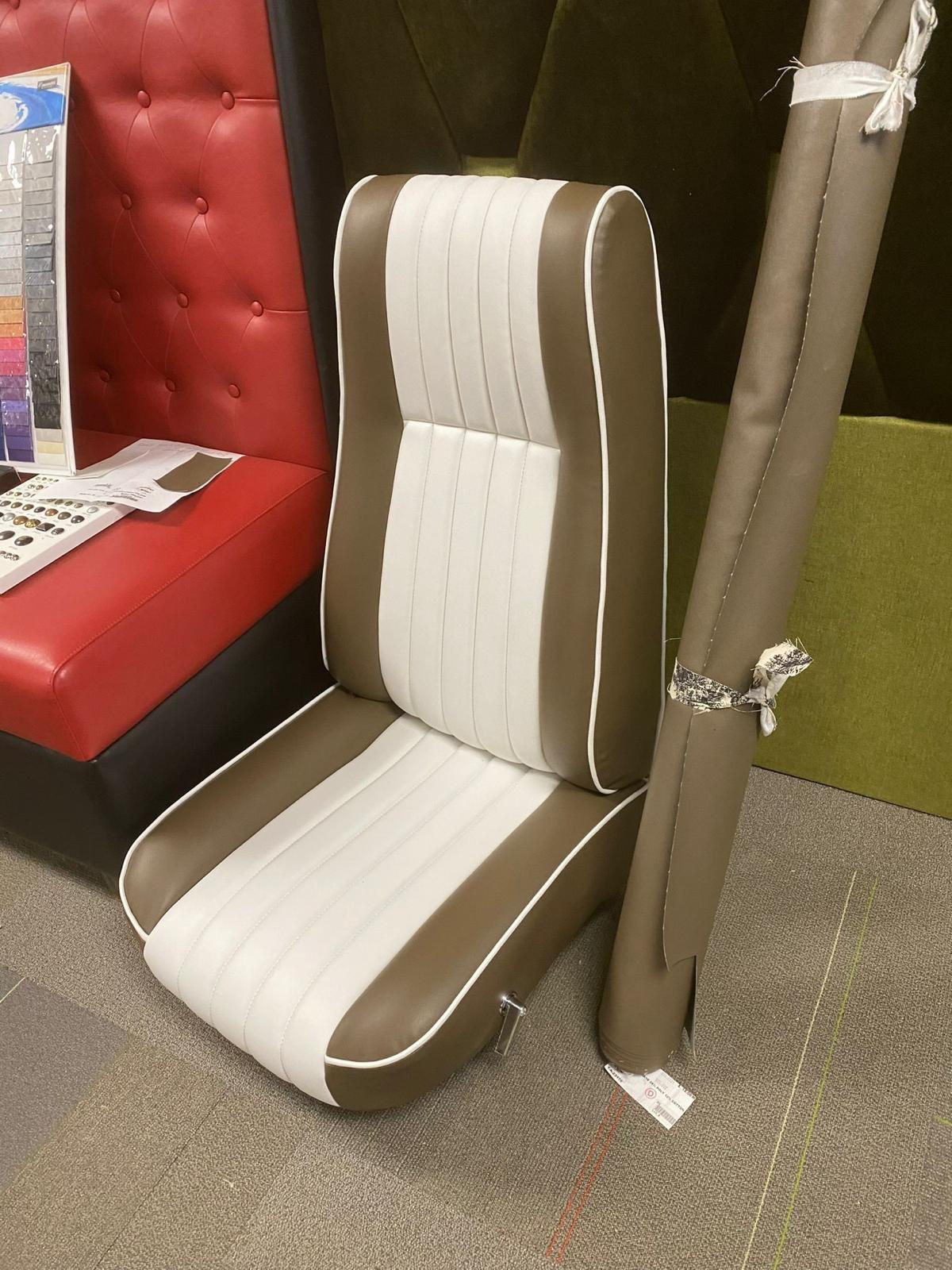Custom automotive seat upholstery with striped leather design